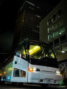 a 56-passenger luxury motorcoach dropping off for a private event