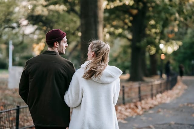 Two people walking in the street