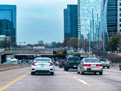 cars on the road in a big city
